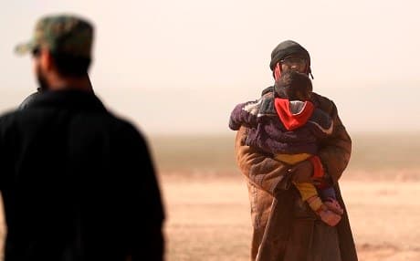 Civilians gather at an SDF outpost near the frontline village of Baghouz on January 26, 2019. Photo: Delil Souleiman/AFP
