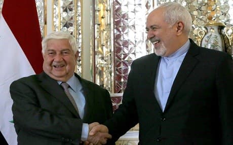 FM Javad Zarif (right) welcomes his Syrian counterpart Walid Muallem in the Iranian capital Tehran on February 5, 2019. Photo: Atta Kenare | AFP