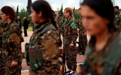 Fighters from the Kurdish Women's Protection Units (YPJ) attend the funeral of a fellow fighter, who was killed while fighting ISIS, in Qamishli on February 9, 2019. Photo: Delil Souleiman/AFP