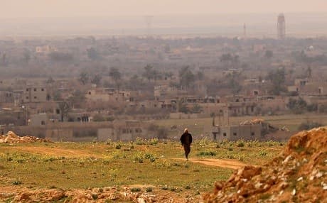 An SDF fighter walks at a position in the Baghouz area on February 14, 2019. Photo: Delil Souleiman/AFP