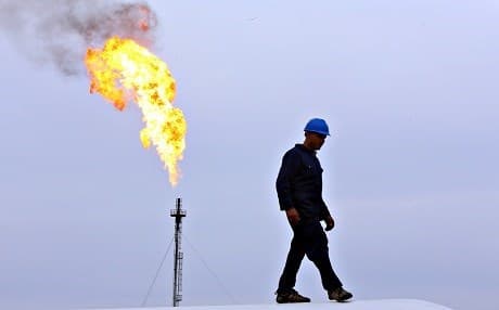 An employee works at an energy facility in the Kurdistan Region. File photo: Rudaw
