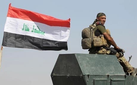An Iraqi soldier sits on top of a military vehicle outside the disputed city of Kirkuk. File photo: AFP