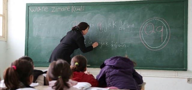 Students learn the Kurdish language at the Musa Bin Nusayr school in the northeastern Syrian city of Qamishli. File photo: Delil Souleiman / AFP 