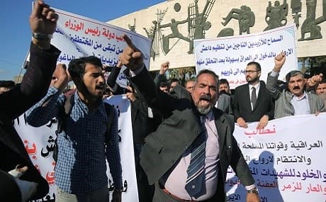 Iraqi Muslims and Yezidis demonstrate in Tahrir Square in central Baghdad to demand an investigation into the mass grave found near the Islamic State group's last bastion in eastern Syria, March 1, 2019. Photo: Ahmad al-Rubaye / AFP 