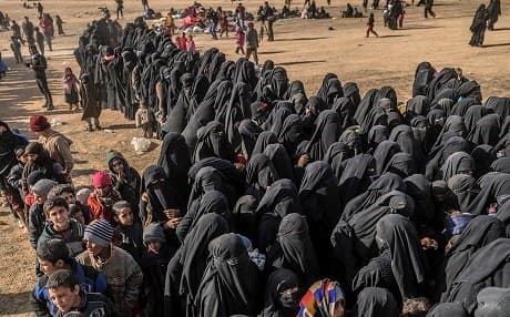 Civilians evacuated from Baghouz wait at a screening area held by the US-backed Kurdish-led Syrian Democratic Forces (SDF) on March 5, 2019. Photo: Bulent Kilic/AFP