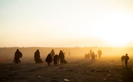 People leave ISIS besieged holdout of al-Baghouz and arrive at a screening area held by the US-backed Kurdish-led SDF on March 6, 2019. Photo: Delil Souleiman | AFP