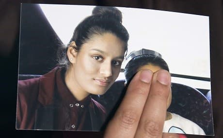 In this file photo taken on February 22, 2015, Renu Begum, eldest sister of missing British girl Shamima Begum, holds a picture of her sister while being interviewed by the media in central London. File photo: Laura Lean/AFP/pool