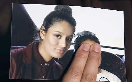 In this file photo taken on February 22, 2015, Renu Begum, eldest sister of missing British girl Shamima Begum, holds a picture of her sister while being interviewed by the media in central London. File photo: Laura Lean/AFP/pool