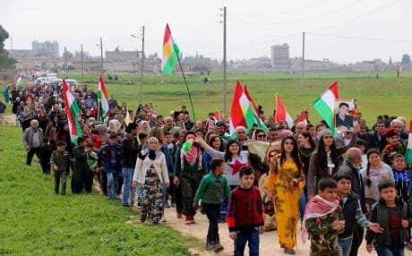 Kurds parade to a friendly football match with an Arab team 15 years after racial tensions poured over in Qamishli on March 12, 2019. Photo: Qamishlo2013 FB