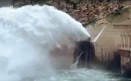 The earthquake-damaged Darbandikhan Dam releases water to ease pressure after two weeks of rains in early April 2019. Photo: Rudaw TV