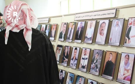 A man looks at portraits of killed and/or missing Yezidis on a wall in a building in Kocho village, Shingal, on March 15, 2019. File photo: Mahdi Faraj | Rudaw