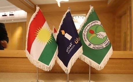 The flags (left to right) of the Kurdistan Region, Gorran, and the Patriotic Union of Kurdistan (PUK). Photo: PUK
