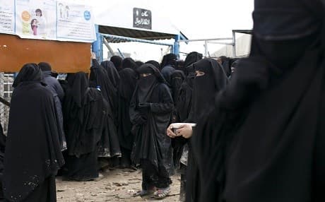 Women line up for aid supplies at Al-Hol camp in Hassaka province, Syria, on March 31, 2019. Photo: Maya Alleruzzo | AP
