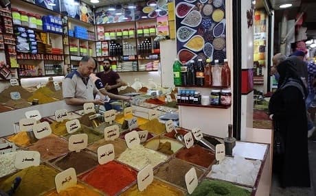 Iraqis shop food products ahead of the Muslim fasting month of Ramadan at the Sadriya market in the capital Baghdad on May 5, 2019.  Photo: Sabah Arar | AFP