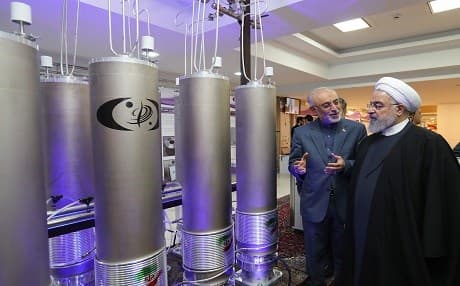 In this file photo made available on April 9, 2019 by the Iranian presidential office, President Hassan Rouhani (right) listens to head of Iran's nuclear technology organisation Ali Akbar Salehi during the "nuclear technology day" in Tehran. Photo: AFP/Iranian presidency handout