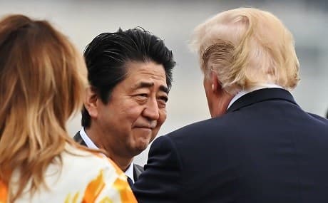 Japan’s Prime Minister Shinzo Abe speaks with US President Donald Trump in Yokosuka, Japan, May 28, 2019. Photo: Charly Triballeau / pool / AFP 