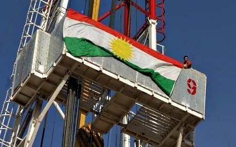 A Kurdistan flag hangs on an oil drill in Zakho, Kurdistan Region. File photo: AP