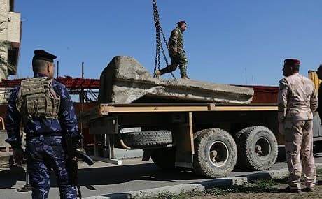 Iraqi security forces remove concrete blast walls in Baghdad, Iraq, February 3, 2019. File photo: Khalid Mohammed / AP
