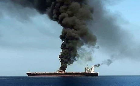 Smoke billowing from a tanker said to have been attacked off the coast of Oman, June 13, 2019. Photo: IRIB / AFP