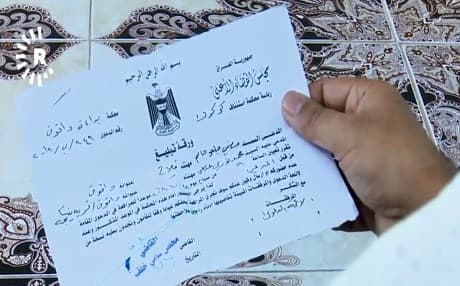 Daquq farmer Mohammed Nuri shows Rudaw his land paperwork 