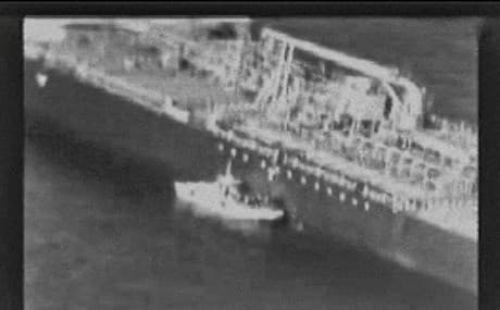 CENTCOM video released on June 13, 2019 reportedly shows an Iranian navy patrol boat in the Gulf of Oman approaching the Japanese operated methanol tanker Kokuka Courageous and removing an unexploded mine. Photo: US Central Command (CENTCOM) / AFP