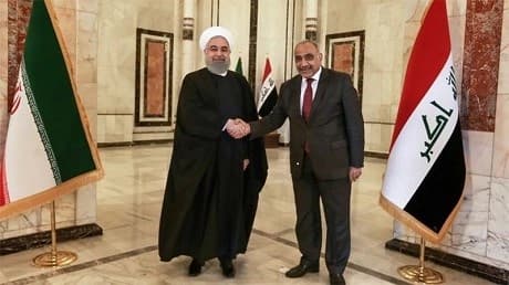  Iraqi Prime Minister Adel Abdul Mahdi (right) shaking hands with Iranian President Hassan Rouhani at the government palace in Baghdad on March 11, 2019. (PMO office / AFP)