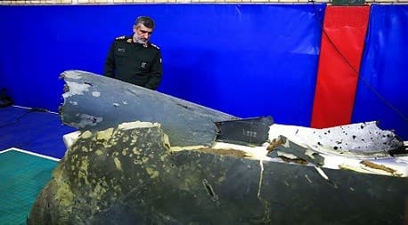 Commander Ali Hajizadeh, head of IRGC Aerospace, inspects the remaining parts of the RQ-4 Global Hawk shot down on Thursday morning by an IRGC 3rd Khordad surface-to-air missile system on June 21, 2019. Photo: Farsnews / Mohsen Ataei 