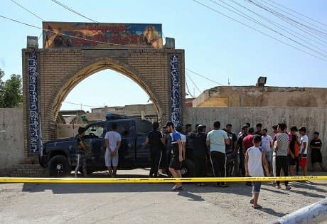 Members of the Iraqi security forces outside the entrance of a Shiite mosque in the Baladiyat district of the capital Baghdad on June 21, 2019, following an explosion. PHOTO: AFP / Ahmad al-Rubaye