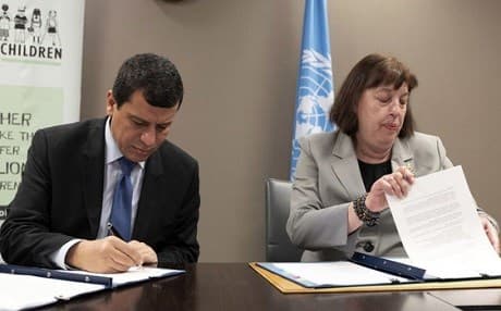 Virginia Gamba, UN Special Representative for Children and Armed Conflict, and Mazloum Kobane (Ferhat Abdi Shahin), Commander of the SDF, sign a Plan of Action to stop recruiting child soldiers, 29 June 2019. Photo: Jean Marc Ferre | UN