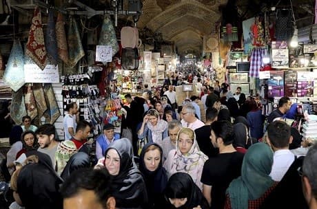 People shop at the old main bazaar in Tehran, Iran, Tuesday, July 2, 2019. Photo: AP/ Ebrahim Noroozi