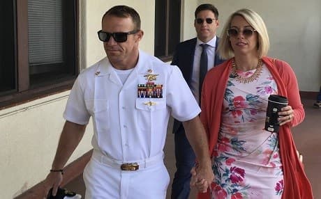 Navy Special Operations Chief Edward Gallagher, left, walks with his wife, Andrea Gallagher as they arrive to military court on Naval Base San Diego, Monday, July 1, 2019, in San Diego. Photo: Julie Watson | AP