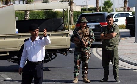 Kurdish security stand guard outside a restaurant where three people were shot dead in Erbil, July 17, 2019. Photo: Safin Hamed / AFP