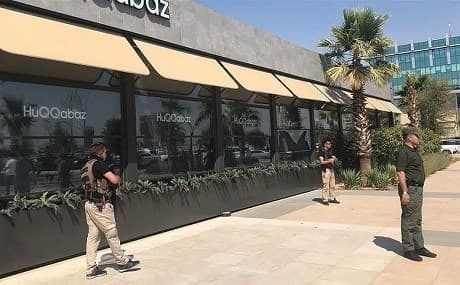 Kurdish security forces stand guard outside Erbil's HuQQabaz restaurant, July 17, 2019. Photo: AA