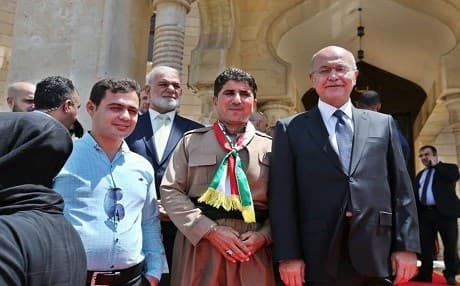 Iraqi President Barham Salih (center right) stands next to Hassan Ali Haji Faraj, an Anfal survivor from Garmiyan, outside the Presidential Palace, Baghdad, Iraq, on July 31, 2019. Photo: Iraqi presidency