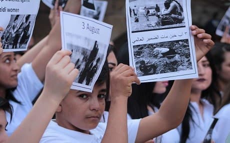 Children commemorate the fifth anniversary of the Yezidi genocide at a ceremony at the holy site of Lalish on August 2, 2019. Photo: Yezidi Supreme Spiritual Council 