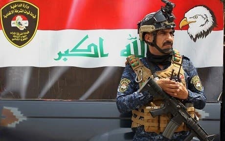 Iraqi federal policeman stands guard. File photo: Ahmad Al-Rubaye / AFP