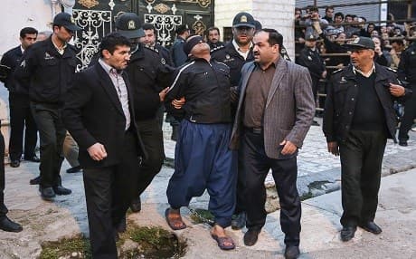 Blindfolded, convicted Iranian man Bilal Gheisari is escorted to his execution in Nour, Iran on April 15, 2014. He was pardoned moments before being hanged. File photo: AP/ ISNA/ Arash Khamoushi