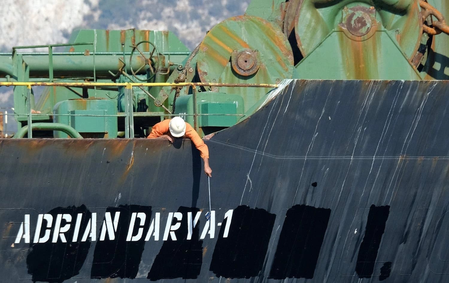 A crew member checks the new name of Iranian oil tanker Adrian Darya, formerly known as Grace 1, off the coast of Gibraltar, August 18, 2019. File photo: Johnny Bugeja / AFP