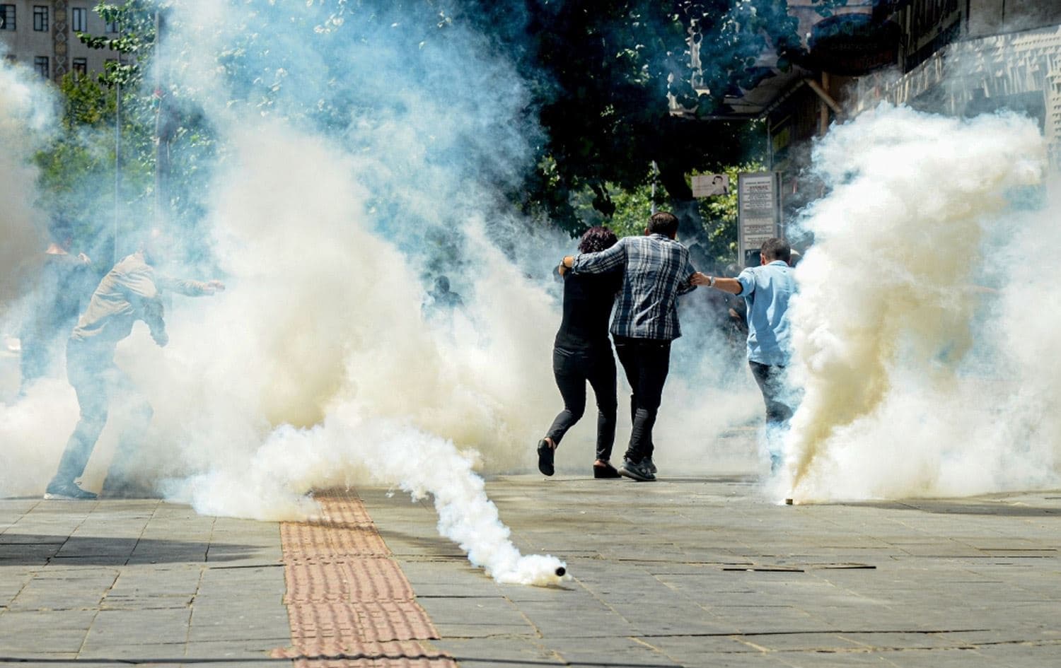 Turkish anti-riot police officers use tear gas to disperse protesters in Diyarbakir, Turkey on August 20. Photo: AFP