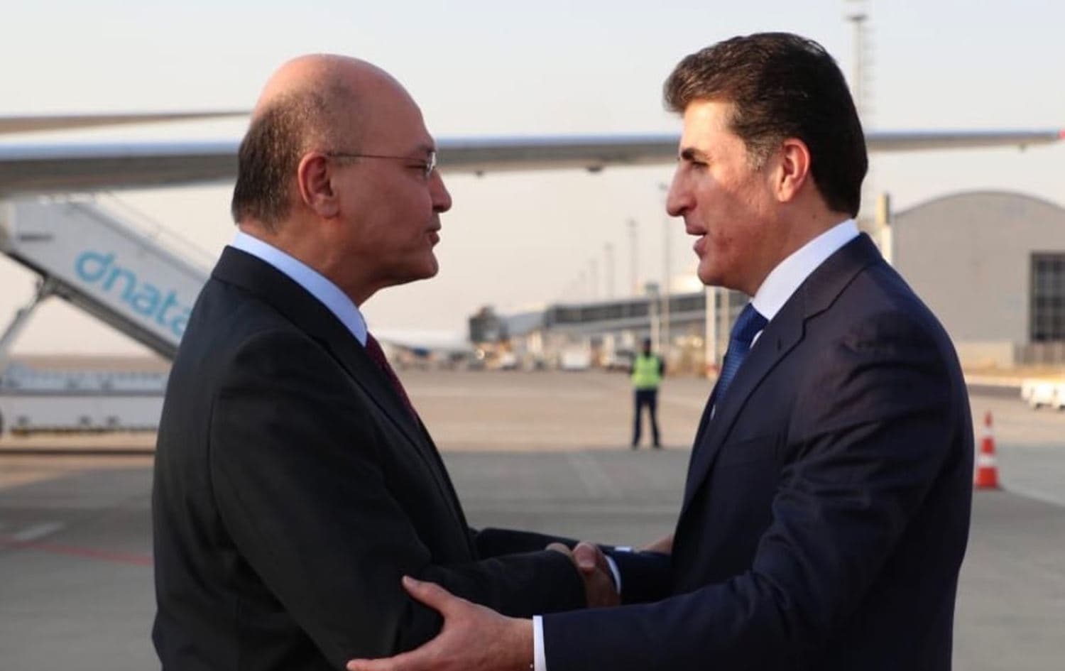 Iraq's President Barham Salih (L) is greeted by Kurdistan Region President Nechirvan Barzani at Erbil International Airport, September 17, 2019. Photo: Iraqi Presidency 