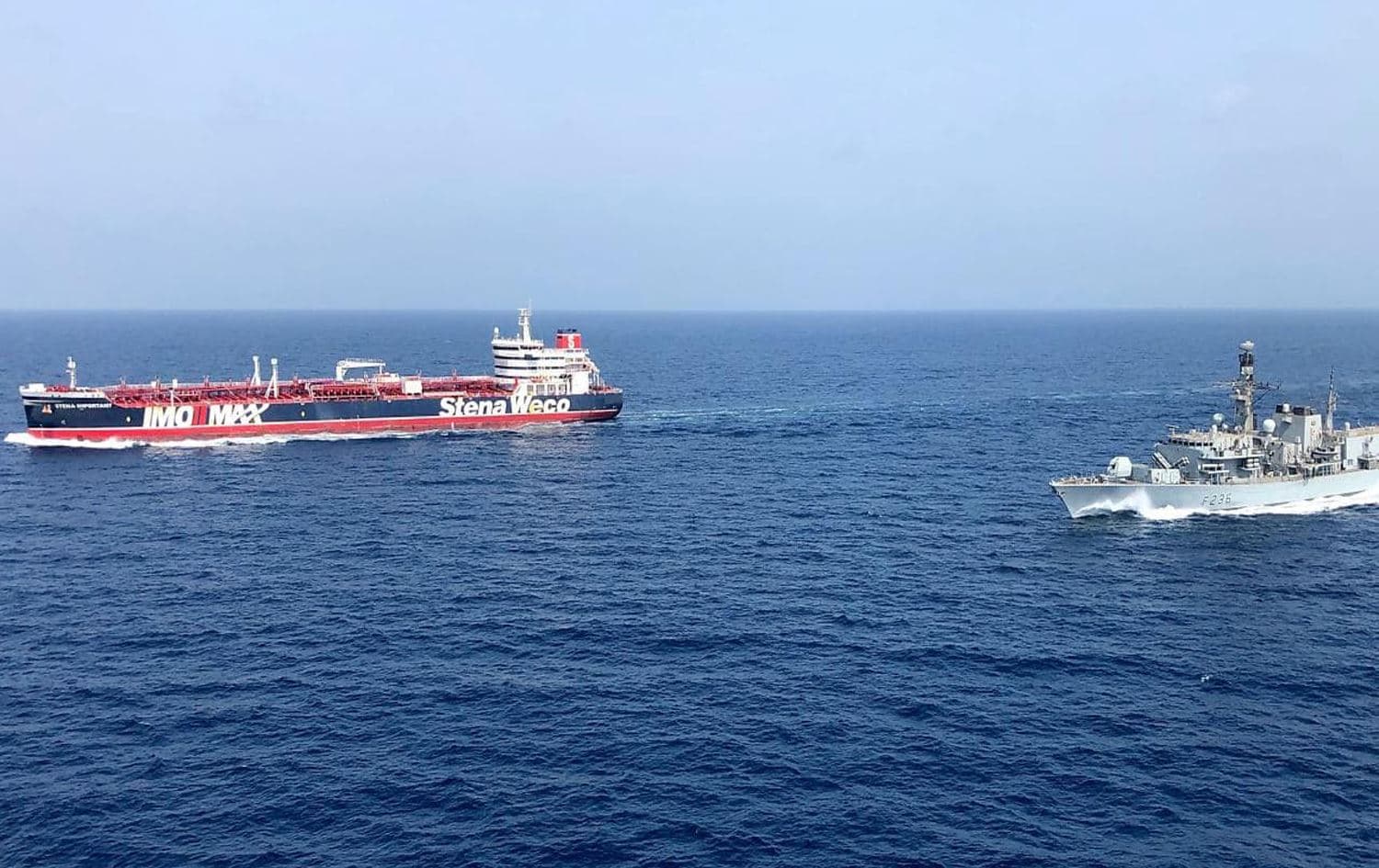 A British tanker (left) accompanied by the British Royal Navy HMS Montrose in the Persian Gulf on August 5. Photo: AFP