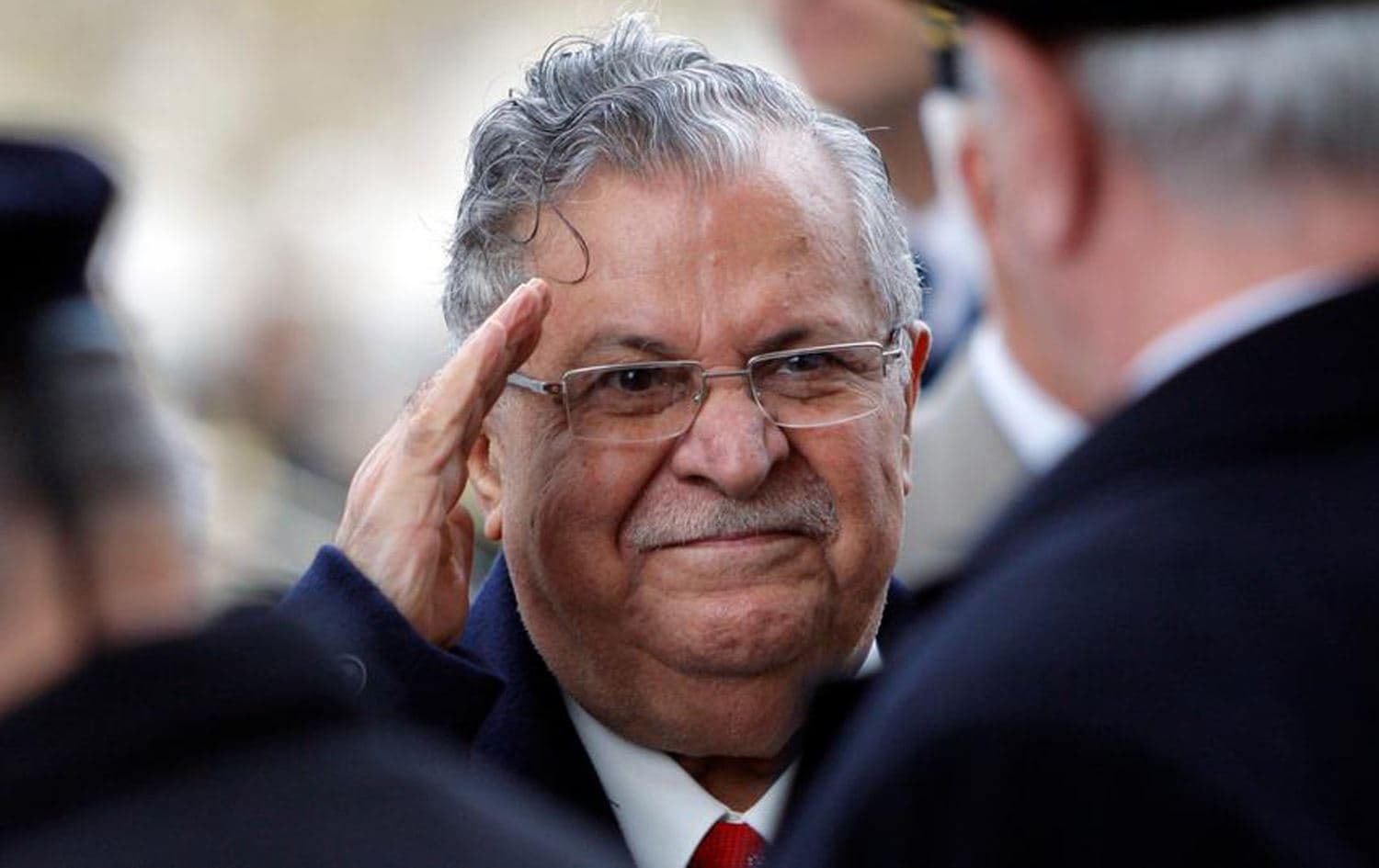Then-Iraqi president Jalal Talabani salutes war veterans at the Tomb of the Unknown soldier under the Arc de Triomphe in Paris during his first state visit to France, November 17, 2009. File photo: Christophe Ena / pool / AP