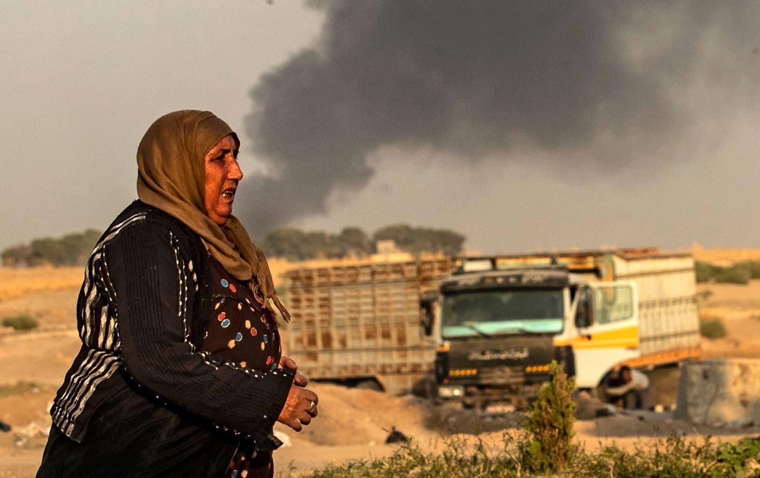 Welatiyeka Kurd li Serê Kaniyê, di dema êrîşa Tirkiyê bo ser Rojavayê Kurdistanê de li ser sînor e. Wêne: AFP