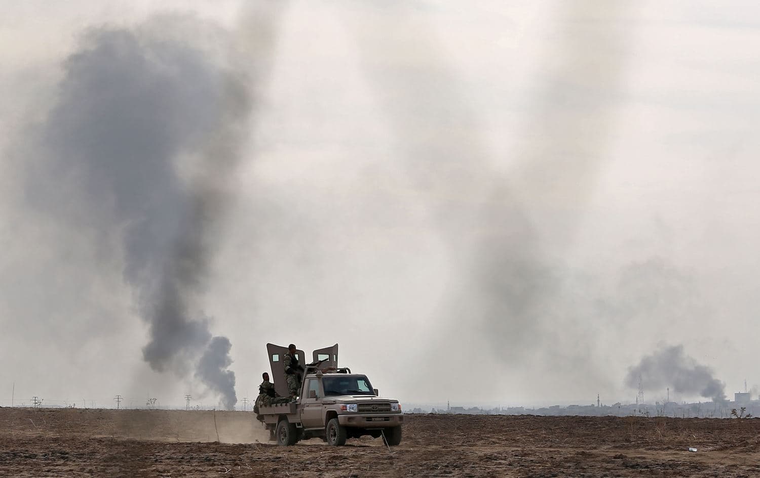 Pro-Turkish Syrian fighters ride in Syria's northeastern town of Sari Kani (Ras al-Ain) in Hasakeh province along the Turkish border as they take part in an offensive against Kurdish-controlled areas in northeastern Syria launched by the Turkish military, on October 11, 2019. Photo: Nazeer al-Khatib/AFP
