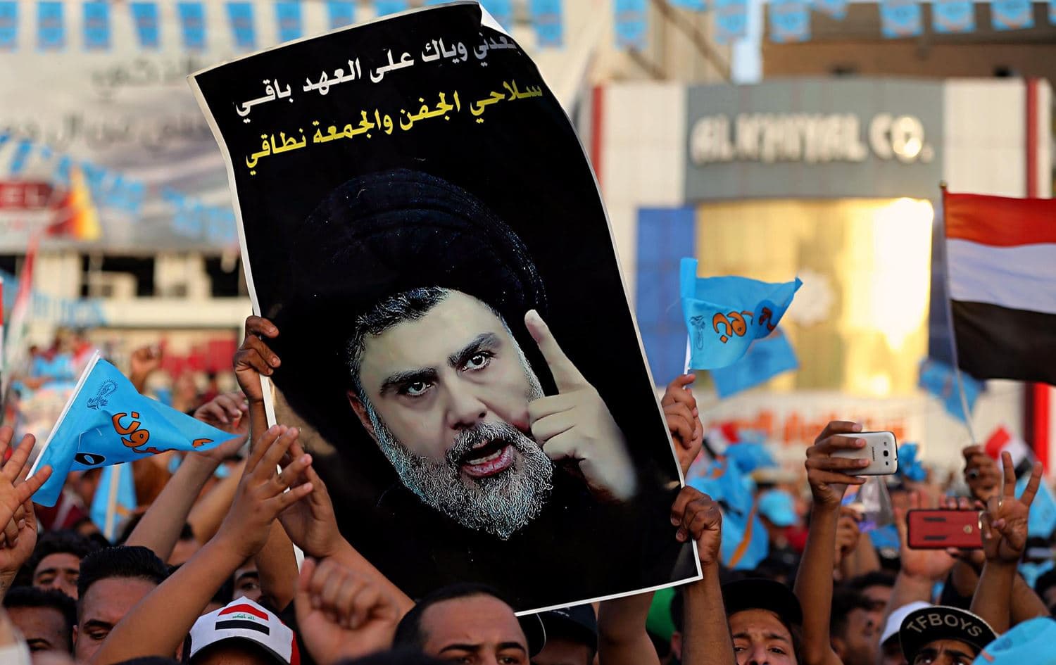 Followers of Shiite cleric Muqtada al-Sadr, seen in the poster, take part in a campaign rally in Baghdad's Tahrir Square on May 4, 2018. File photo: Karim Kadim / AP 