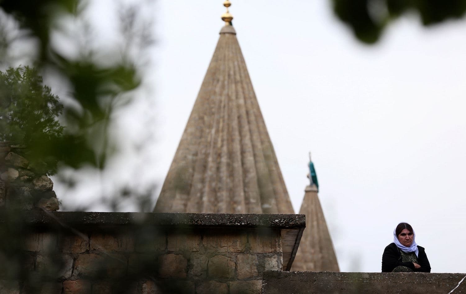 An Iraqi Yazidi woman stands outside Lalish temple in April, 2015. Photo: AFP