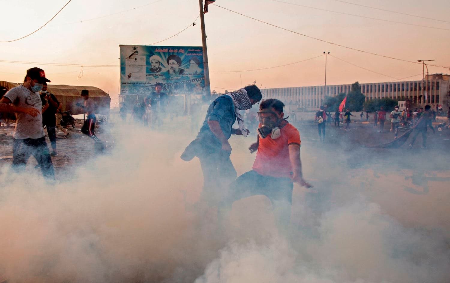 Iraqi protesters wear masks to protect themselves from tear gas as they take part in an anti-goverment demonstration in the southern city of Basra on November 8, 2019.Photo: Hussein Faleh/AFP