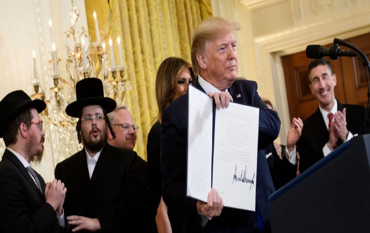US President Donald Trump with an executive order regarding anti-Semitism at a Hanukkah reception in the White House on December 11, 2019. Photo: Brendan Smialowski/AFP