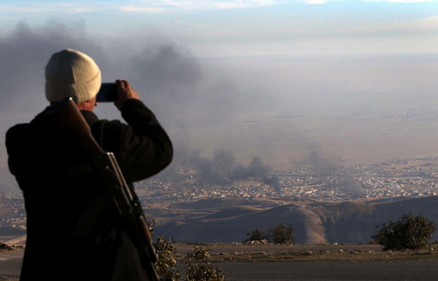 A displaced Yazidi man looks over Sinjar on November 12, 2015. Photo: Safin Hamed/AFP/Getty Images