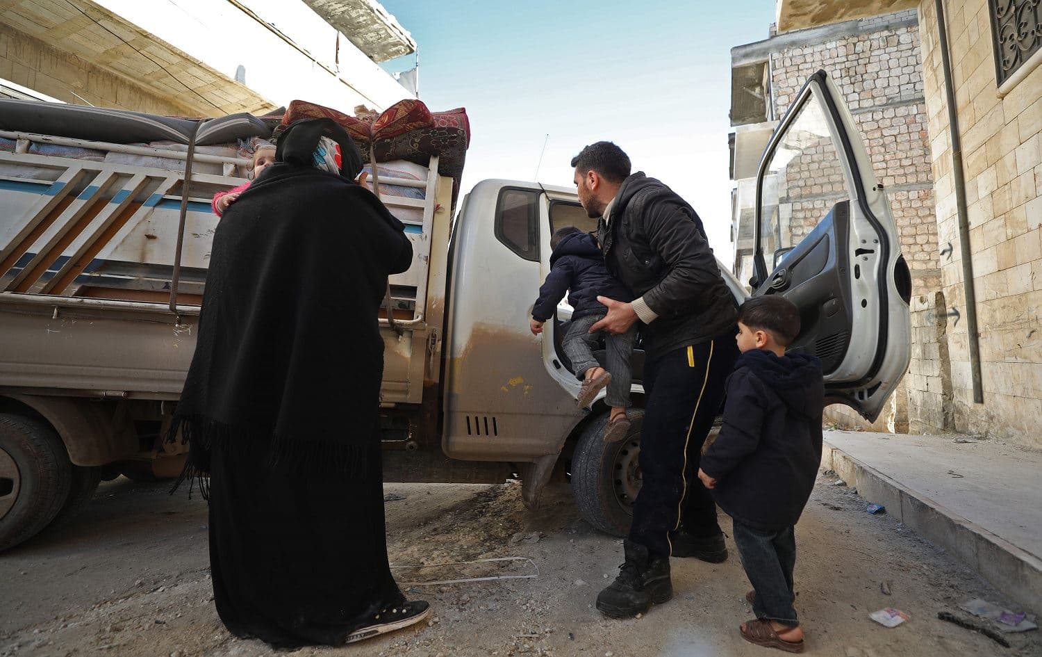 Abu Oussama and his family prepare to flee bombardment in the jihadist-held town of Maaret al-Numan in Syria's southern Idlib governorate on December 20, 2019. Photo: Omar Haj Khadour/ AFP 